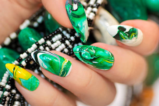 istock Stone nail design in white and green colors. 684192758