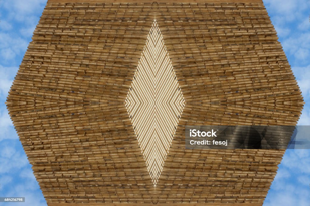 Wood ornamental pattern against blue sky Wood ornamental pattern as a symmetrical background against blue sky Abstract Stock Photo
