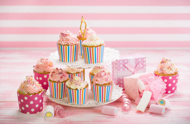 istock Cupcakes with pink and white icing 684229360