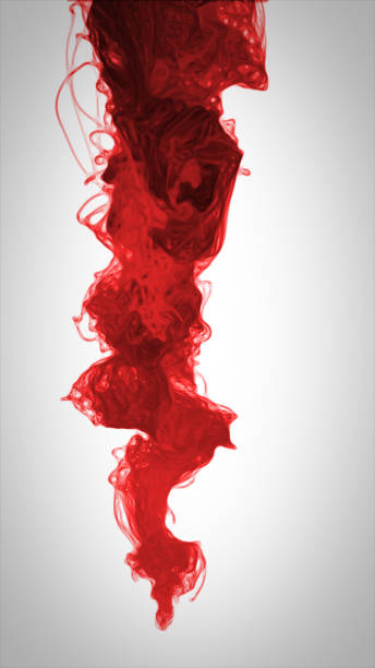 istock red color paint pouring in water 684249380