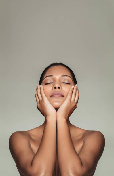 istock Pretty female touching her fresh clean face 684256066