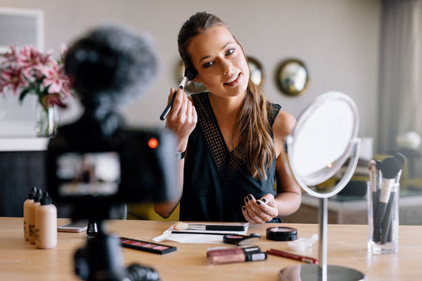 istock Young female vlogger recording a make-up broadcast. 684256416