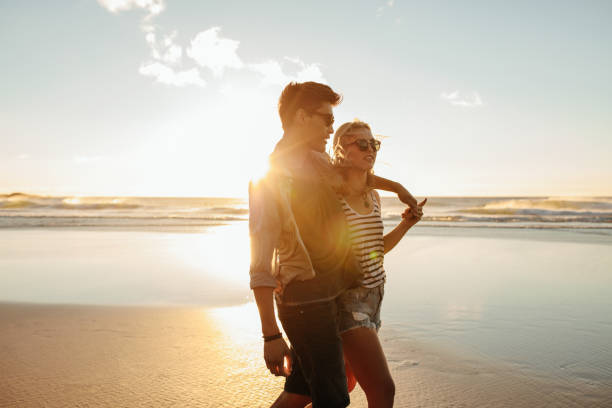 istock Beautiful young couple together on seashore 684256644