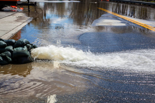 istock Pumping water away From Flooded Road 684276004