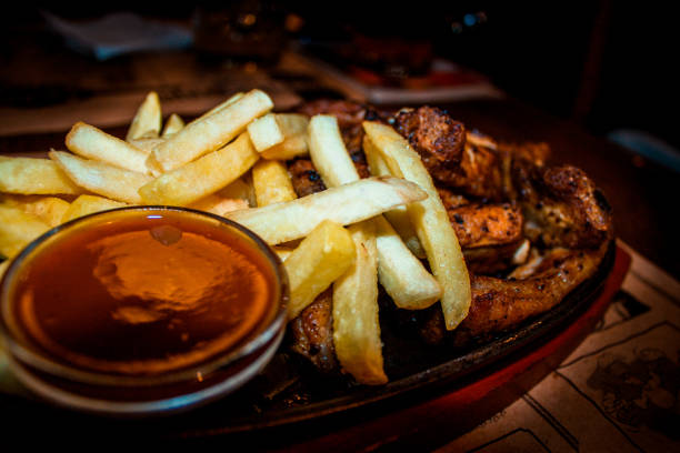 Appetizing delicious pork ribs with potatoes Grilled