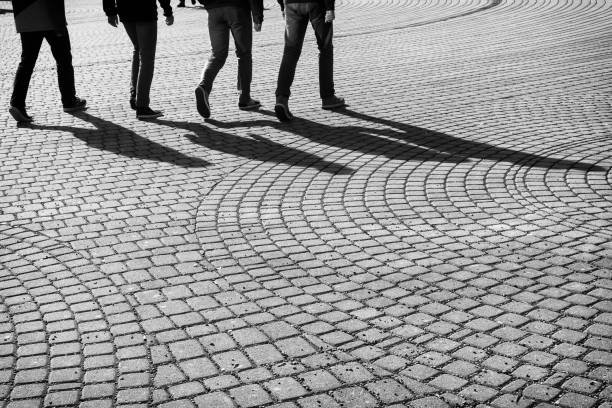 istock City Zilina crowded by walking people with shadows. 684307258