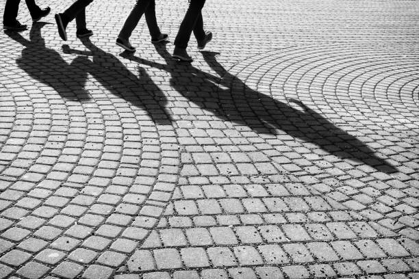 istock City Zilina crowded by walking people with shadows. 684311406