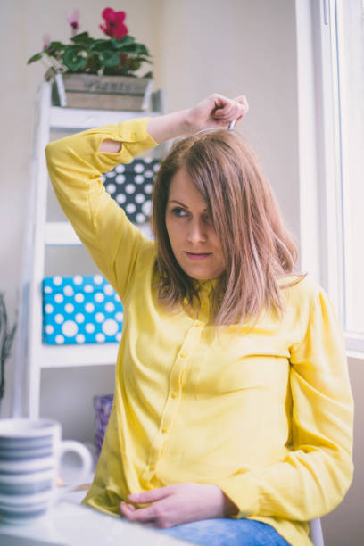 istock pretty girl sitting at desk in bright office, 684359822