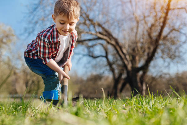 istock Industrious child gardening in spring 684360128
