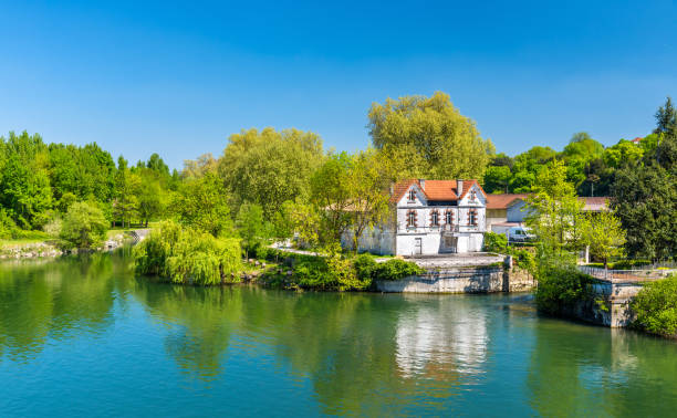 Picturesque landscape of the Charente River at Cognac, France Picturesque landscape of the Charente River at Cognac - France cognac stock pictures, royalty-free photos & images