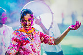 Young Indian people, with their colorful faces and clothes, celebrating the Holi Festival celebration in Jaipur India.