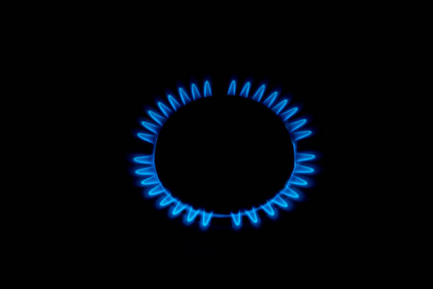 istock Gas burner flames view from the top isolated on black 684447138