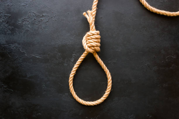 istock running knot of rope on a black background. Concept stop suicide 684450762