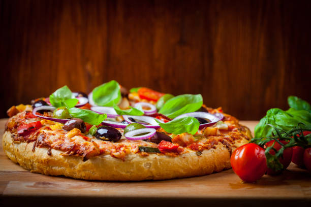 istock Traditional homemade pizza with tomatoes, olives and basil 684450774