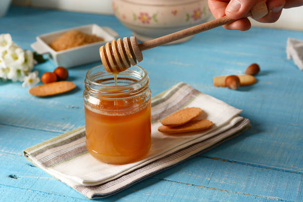 istock Organic honey in glass jar 684451376