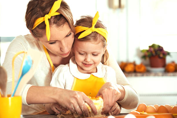 istock Mother and Daughter Making Dough 684454716