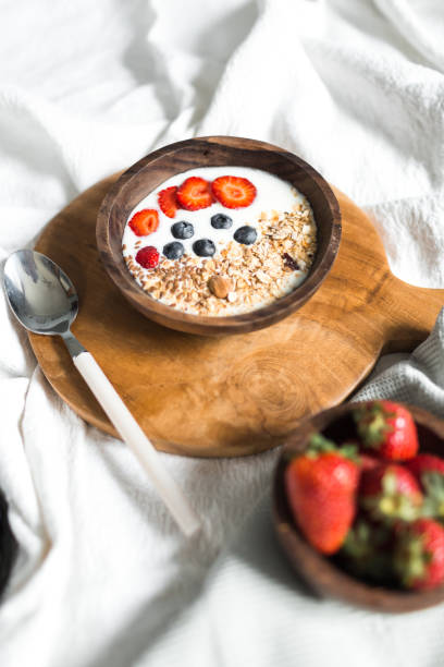 istock Oatmeal with strawberries and blueberries on a white sheet 684458472