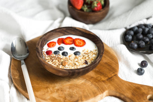 istock Oatmeal with strawberries and blueberries on a white sheet 684463000