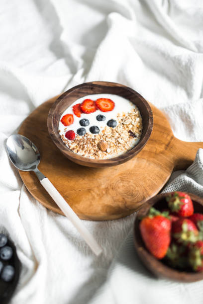 istock Oatmeal with strawberries and blueberries on a white sheet 684467364