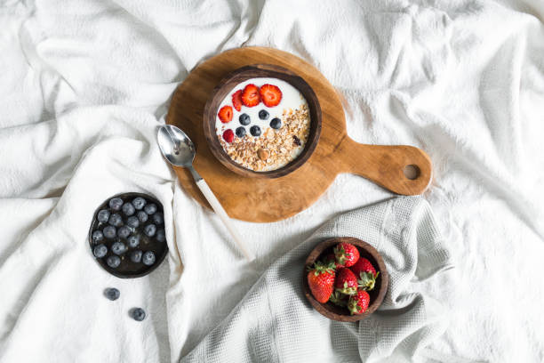 istock Oatmeal with strawberries and blueberries on a white sheet 684467514