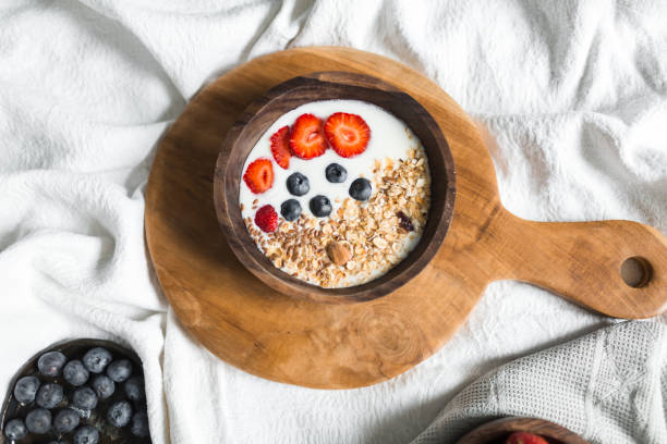 istock Oatmeal with strawberries and blueberries on a white sheet 684469958