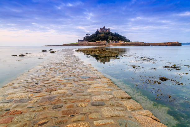 St. Michael's Mount reflection perfect still reflection in tide pool as the waters recede from the mount's causeway in the morning light marazion photos stock pictures, royalty-free photos & images