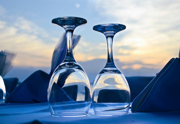 wedding glasses in front of the sunset - greek wedding decoration
