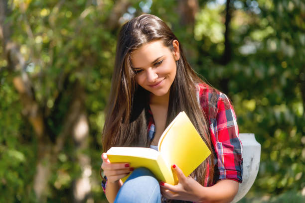 istock Girl studying in the park 684470962