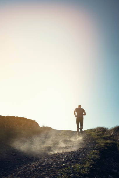 istock Man fell running in remote hillside location. 684471052