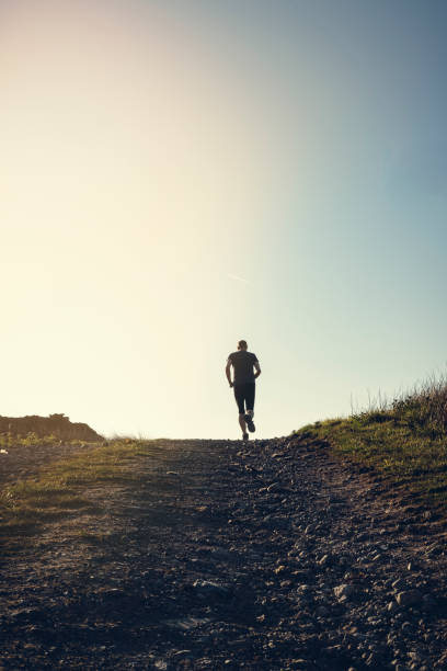 istock Man fell running in remote hillside location. 684471074