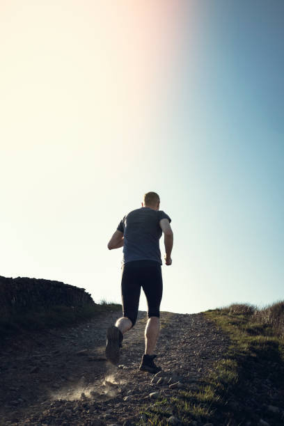 istock Man fell running in remote hillside location. 684471076
