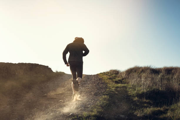 istock Man fell running in remote hillside location. 684471086