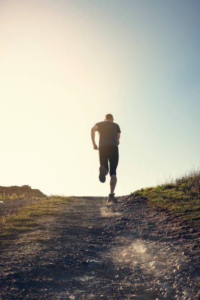 istock Man fell running in remote hillside location. 684471088
