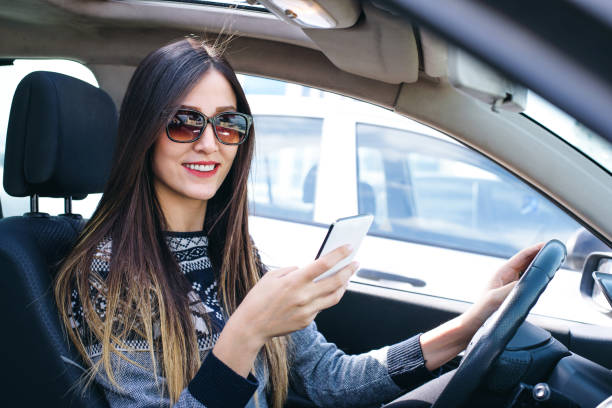 istock Beautiful young woman using mobile phone 684471450