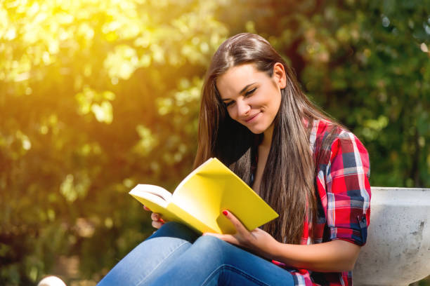 istock Student girl studying in the park 684473846