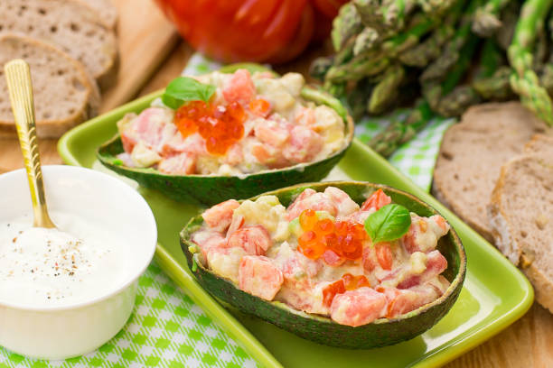 istock Stuffed avocado with tomato, garlic and mayonnaise 684475090