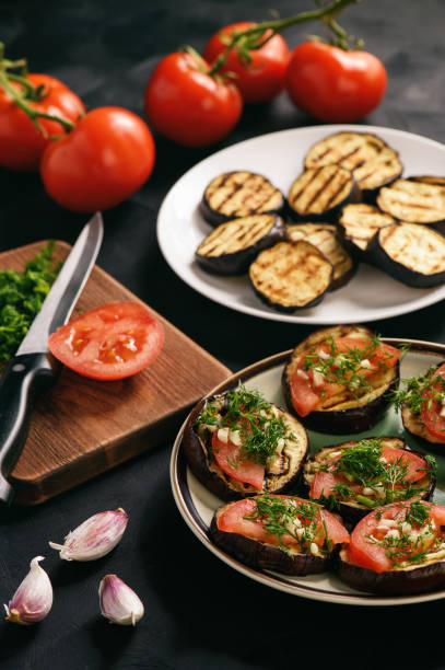 istock Appetizers- grilled eggplants with tomatoes, garlic and dill. 684475264