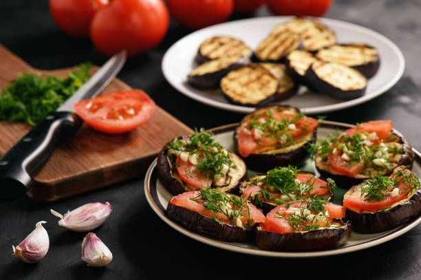 istock Appetizers- grilled eggplants with tomatoes, garlic and dill. 684475284