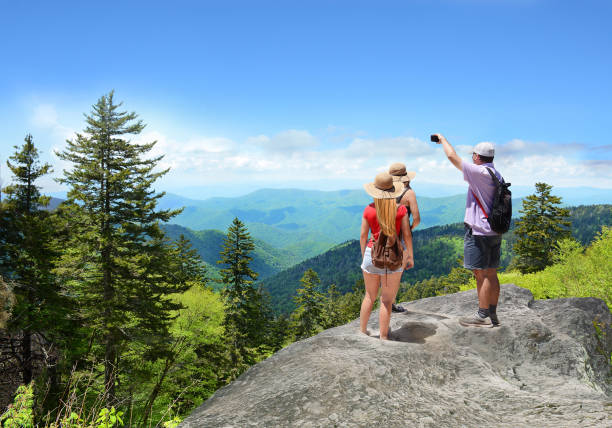istock Family hiking on vacation in summer mountains. 684475302