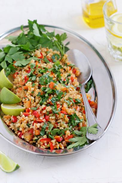 istock Tabbouleh.Traditional bulgur salad with vegetables and herbs. 684479762