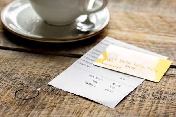 istock paying check for lunch with card wooden table background 684481848
