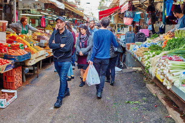 Tel-Aviv - 4 December, 2016: The "Carmel" market in Tel Aviv and it's visitors stock photo
