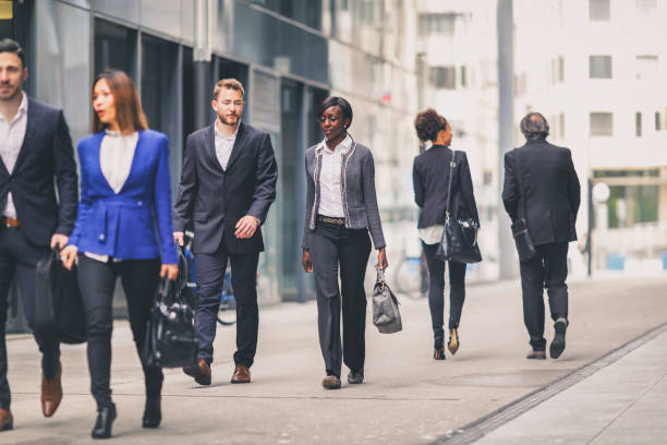 istock Group of business people walking 684522620