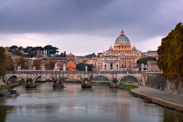 istock Tiber River and Saint Peter Cathedral in the Evening, Rome, Italy 684529992