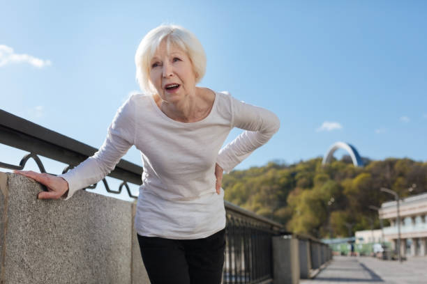 istock Senior woman feeling backache on the open air 684533182