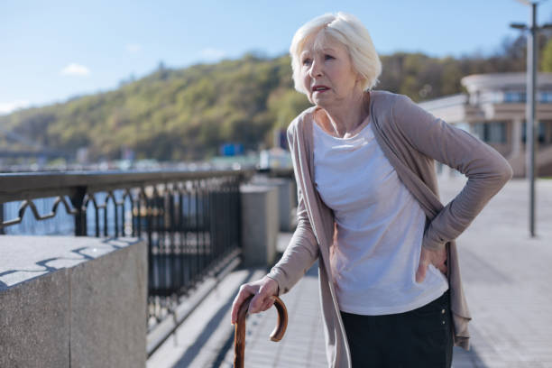 istock Retired woman having lower back pain during the promenade 684535418