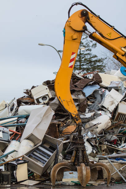 istock Metal recycling yard. Powerfull mechanical grabbyng arm. 684536136