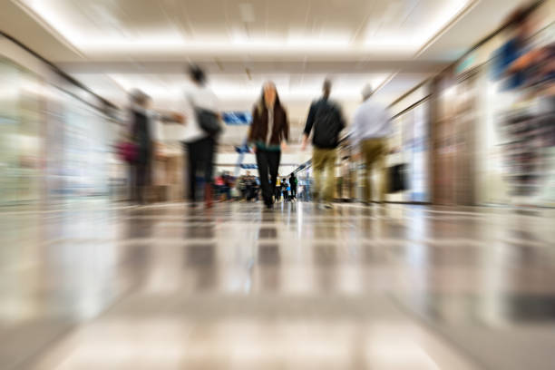 Blurred customers walking in shopping mall, Hong Kong