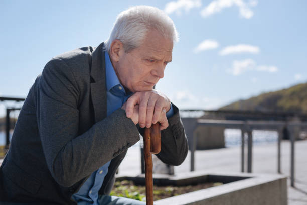 istock Upset pensioner expressing sadness in the park 684539818