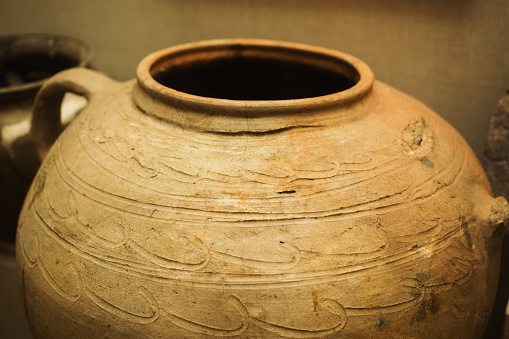 Clay ancient jug with a pattern. Old dishes. A vessel for water.